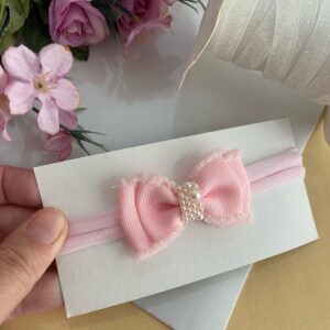 Faixa com laço rosa