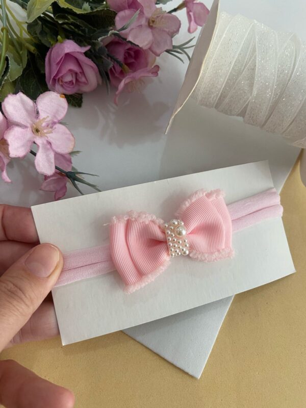 Faixa com laço rosa