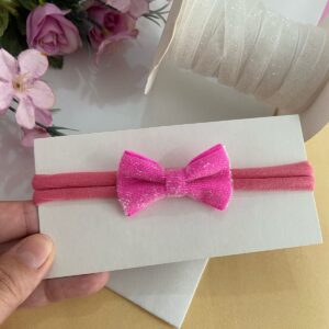 Faixa RN com Laço Rosa.
