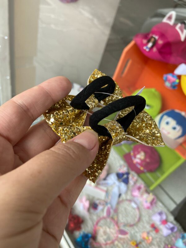 Par de Laços Dourado com Rabicó - Imagem 2