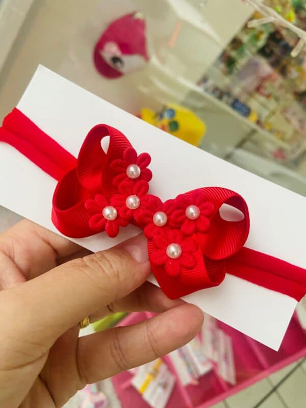 Faixa RN Vermelho com Flores e pérola.