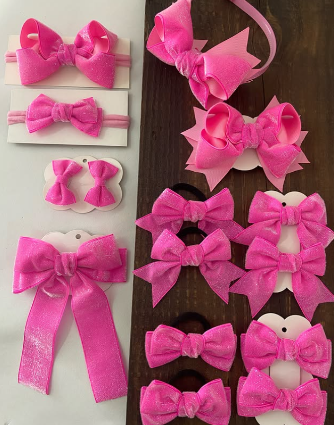 diversos modelos de laços rosa que há na loja laços kids